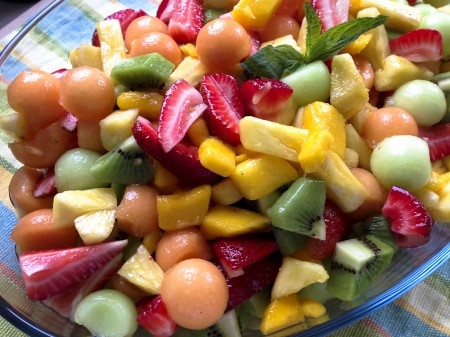 Tropical fruit salad with ginger-mint dressing